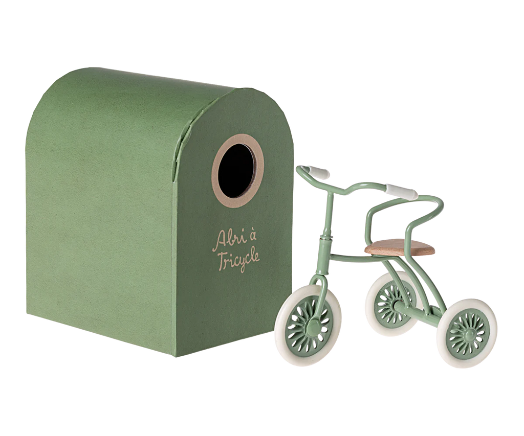 Miniature green tricycle toy