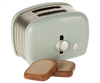 Maileg | Miniature Toaster - Mint with two slices of toasted bread ejected in front, set against a white background.