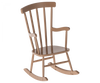 A light brown wooden Maileg Rocking Chair, Mouse - Dark Powder with a traditional spindle back design and curved rockers. The chair has armrests and a simple, classic style, making it the perfect chair for any cozy corner.