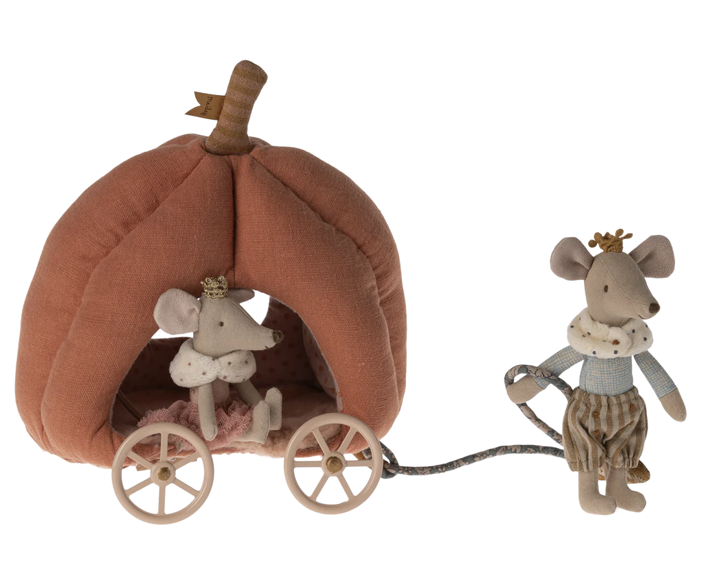 A soft fabric toy set featuring the Maileg Pumpkin Carriage: a mouse dressed as a princess sitting inside a plush, fairytale carriage shaped like a pumpkin with wheels. Another mouse, in a regal outfit, pulls the carriage by a rope, both wearing tiny crowns fit for royalty.