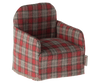 The Maileg Chair, Mouse - Red Checker is a miniature armchair featuring a red checker fabric pattern, ideal for small Maileg friends. Its squared back and cushioned seat make it perfect for dollhouse settings and cozy enough to fit inside the charming Maileg Gingerbread House.