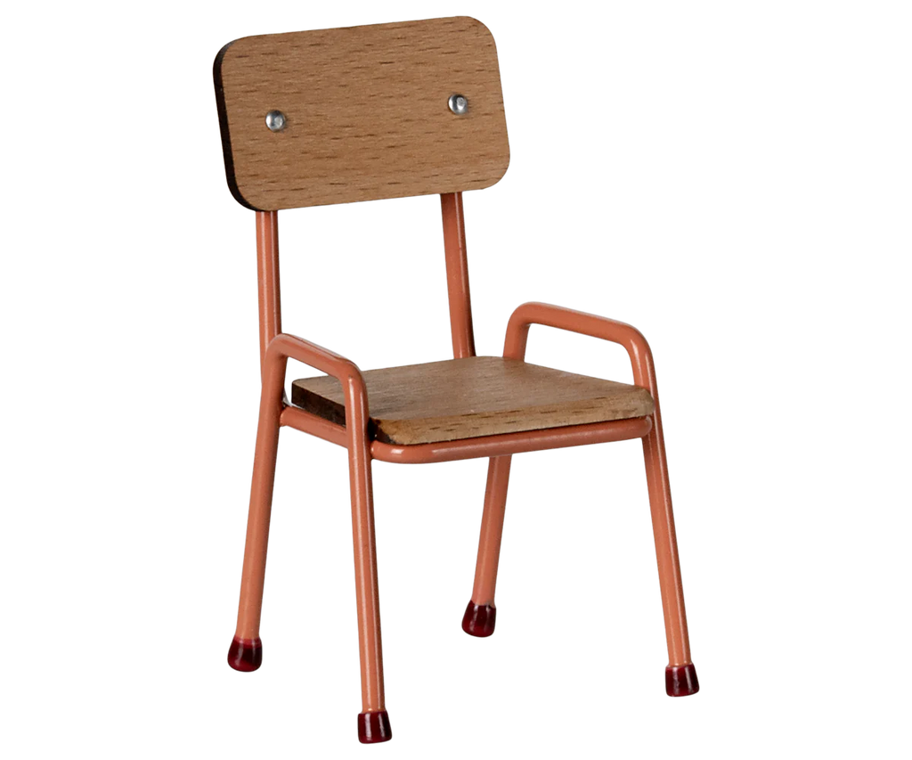 The Maileg Little Sister Bedroom Starter Set includes a small wooden chair with a light brown seat and backrest, orange metal legs, and red rubber caps, ideal for minimalist starter collections.