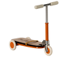 This charming kick scooter, ideal for a starter collection, features a wooden deck with "Moulin" printed on it. It boasts orange and white wheels, an orange frame, and cream handle grips—a delightful piece evoking the whimsical style of Maileg Little Sister Bedroom Starter Set.