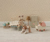 A charming dollhouse scene features mouse dolls in pajamas—some on a soft mattress bed, some with a blanket, and one pushing baby mice in the Maileg Pram, Mouse - Coral. The room has tiny furniture and floral wallpaper.