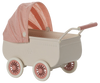The Maileg Pram, Mouse - Coral is a vintage-style toy baby carriage featuring a coral and white checkered canopy, coral wheels, a coral handle, and a soft mattress against a plain background.