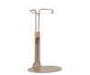 The Maileg Mouse Stand, Small - Sand is a beige minimalist stand with a circular base and upper loop to hold items upright, shown on a plain white background. Ideal for displaying your mice collection.