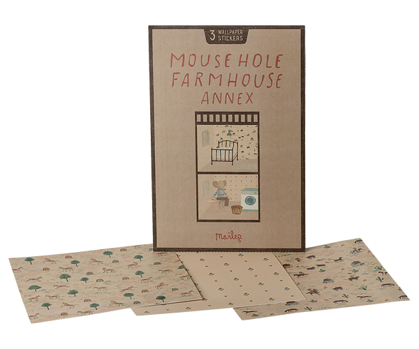 The Maileg Wallpaper, Mouse Hole Farmhouse - Annex set features three patterned wallpaper sheets and room stickers, displayed in front of the illustrated box on a white background.
