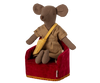 A charming Maileg mouse toy, donned in a plaid outfit with a yellow shoulder bag, sits on the Maileg Soft Chair in Red, perfect for adding whimsy to any Mouse hole Farmhouse setting. Note: Chair is under pre-order and ships in late February.