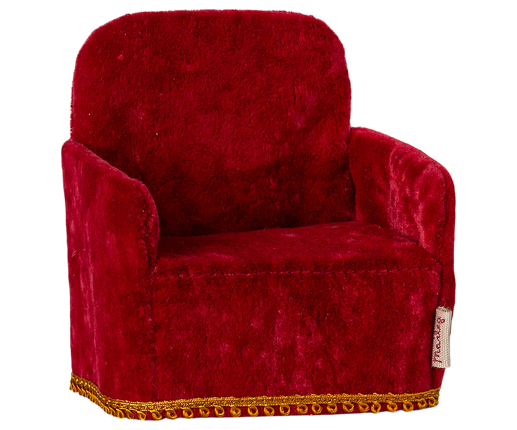 The PRE-ORDER: Maileg Soft Chair - Red, with plush velvety texture and gold trim, adds comfort and style to a cozy Mouse hole Farmhouse. Ideal for Maileg friends, it ships in late February.