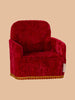 A plush red armchair with golden trim, the PRE-ORDER: Maileg Soft Chair - Red (ships late February) sits against a light brown background, ideal for hosting Maileg guests from Mouse hole Farmhouse.