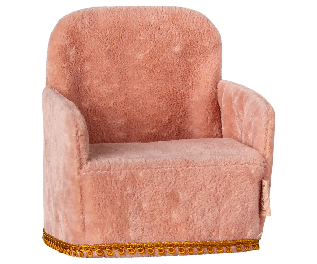 The Maileg Soft Chair - Rose is a charming, small plush pink armchair with a rounded backrest and soft upholstery, ideal for any Mouse hole Farmhouse or Maileg collection. It features gold fringe detailing and is perfect for decorative or toy use. Pre-order now to ship in late February.