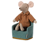 A stuffed toy mouse rests on a Maileg Soft Chair in mint from the small Maileg furniture collection. The mouse wears a brown shirt with blue polka dots and dark striped pants, its large round ears complementing the chair's gold-trimmed elegance.