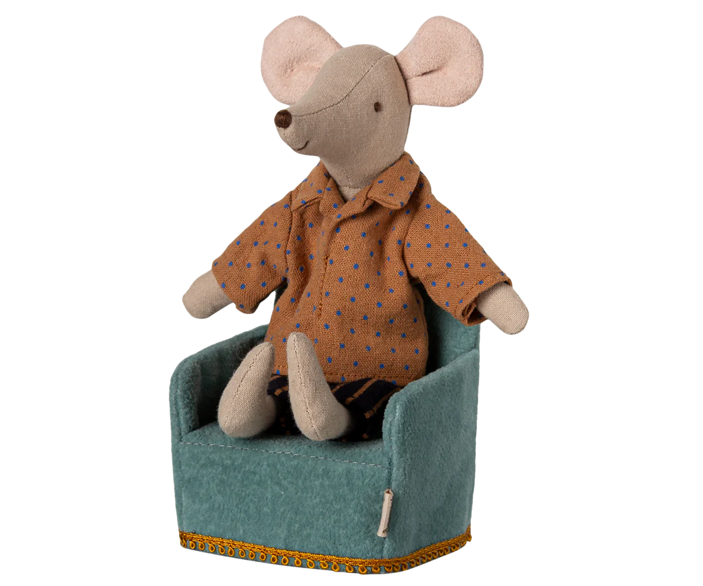 A stuffed toy mouse rests on a Maileg Soft Chair in mint from the small Maileg furniture collection. The mouse wears a brown shirt with blue polka dots and dark striped pants, its large round ears complementing the chair's gold-trimmed elegance.