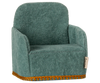 The PRE-ORDER: Maileg Soft Chair - Mint, shipping in late February, is a cozy miniature armchair made for Maileg friends. It features soft green fabric with a slightly curved backrest and armrests and intricate gold trim for an elegant touch, typical of small Maileg furniture.