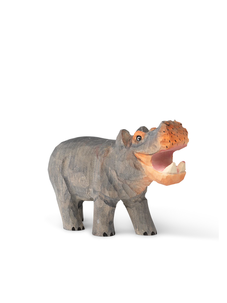A Hand Carved Wooden Hippo sculpture with motion blur effect on the sides, shown on a plain white background. The hippo is depicted with an open mouth, revealing its teeth.