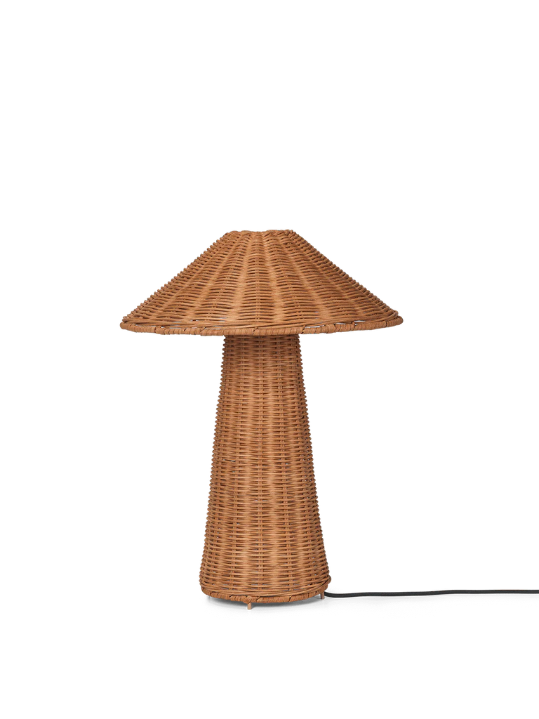 A Ferm Living Dou Table Lamp - Natural with an elongated, cylindrical base and a broad, cone-shaped shade, set against a solid black background.