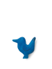A Ferm Living Hand Carved Wooden Bird Hook, hand-carved from natural materials and painted in bright blue, is displayed against a black background. The bird features a primitive and abstract form, emphasizing.