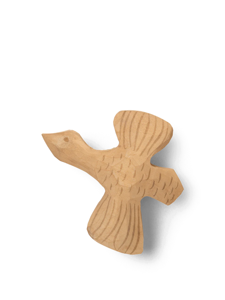 Ferm Living Hand Carved Wooden Bird Hook shaped cutout with visible wood grain, isolated on a black background, serving as whimsical wall decor.