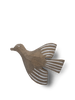 A Ferm Living hand-carved wooden bird hook with simplistic design, featuring a dark brown body and stylized white striped wings and tail, isolated against a black background.