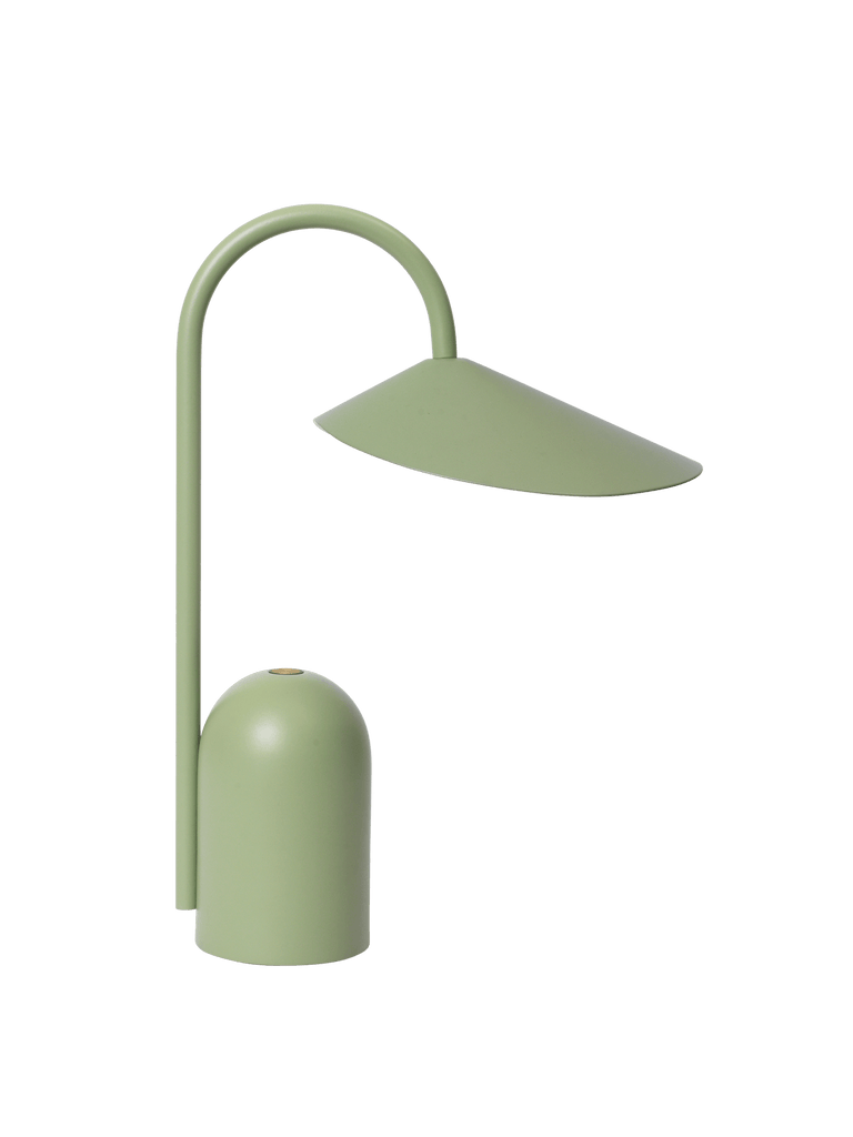 The Ferm Living Arum Portable Lamp in Tea Green features a minimalist, curved tubular stem and wide angled shade, rechargeable design, and is displayed against a plain white background.