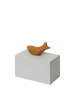 The Ferm Living Hand Carved Wooden Harbour Box - Fish features a small, wooden fish figurine atop a plain, hand-carved box—a charming decor piece perfect for a child's room.