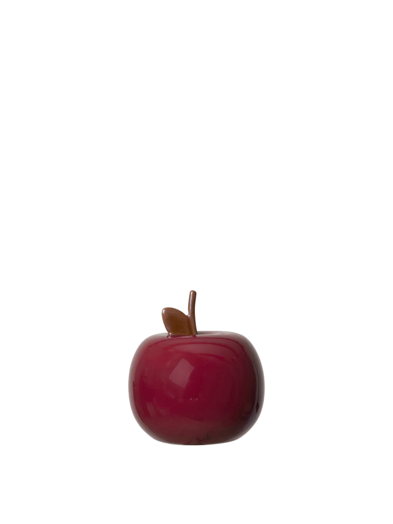 The Ferm Living Apple Money Bank, a deep red ceramic piggy bank with a brown stem and green leaf, is perfect for kids’ room decor and ships in one week.