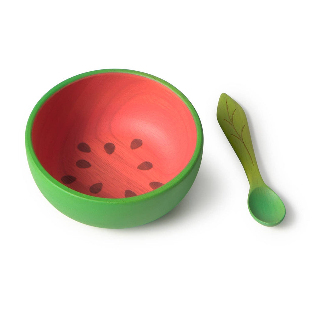 The Wally the Watermelon Bowl & Spoon Set features a non-toxic baby bowl with a green exterior, red interior with black seed designs, and a leaf-shaped wooden spoon—an adorable and safe dinnerware set for little ones.