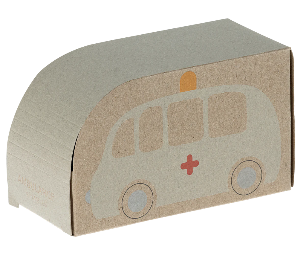 The Maileg Wooden Ambulance is an emergency vehicle toy crafted from solid wood, featuring a minimalist design with a red cross and illustrated wheels. Its curved top resembles an ambulance roof, and it includes a fun pull-back function for interactive play.