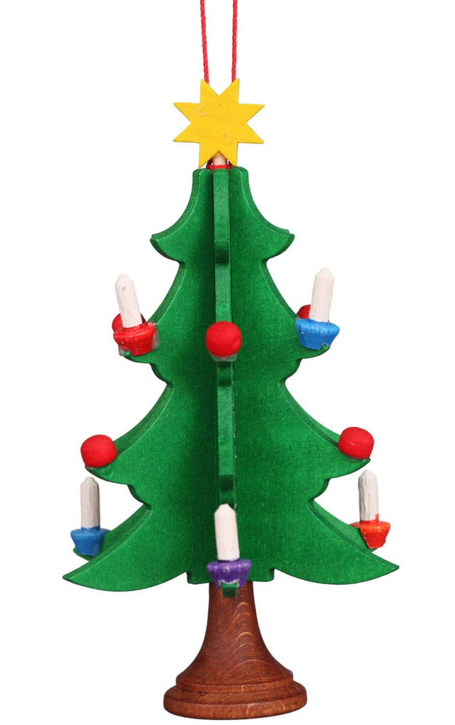 The Christian Ulbricht Ornament - Christmas Tree showcases a hand-painted wooden tree adorned with green branches, vivid red and blue candle holders, white candles, and topped with a bright yellow star, all gracefully hung by a red string.