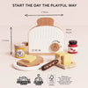 The Pop-up Toaster & Breakfast Set (ships in one week) includes FSC-certified wood toast, butter, jam, honey, knife, and plate. “Start the Day the Playful Way”—eco-friendly and perfect for pretend play. Dimensions shown on a light background.