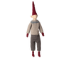A Maileg Christmas Mega Pixy with a red pointy hat, beige face, patterned sweater, gray pants, and red shoes, standing against a white background as a Christmas decoration.