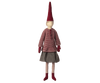 A fabric doll wearing a striped red and white shirt, gray skirt, and striped stockings, with a pointed red hat, standing against a plain background. This exclusive Maileg Christmas Mega Pixy serves as an ideal Christmas 