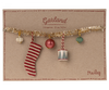 The Christmas garland, Small - Gold is displayed on a brown card, highlighting festive decorations. It features a decorative garland adorned with five ornaments: a striped stocking, a red bauble, a cylindrical piece, and two spherical ornaments in white and green. The card reads "Garland" along with its measurements in centimeters and inches.