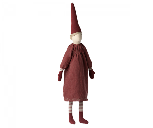 A Maileg Christmas Mega Pixy (Size 6) with a red conical hat, a long-sleeved burgundy dress made from exclusive materials, and striped stockings, standing against a plain background.