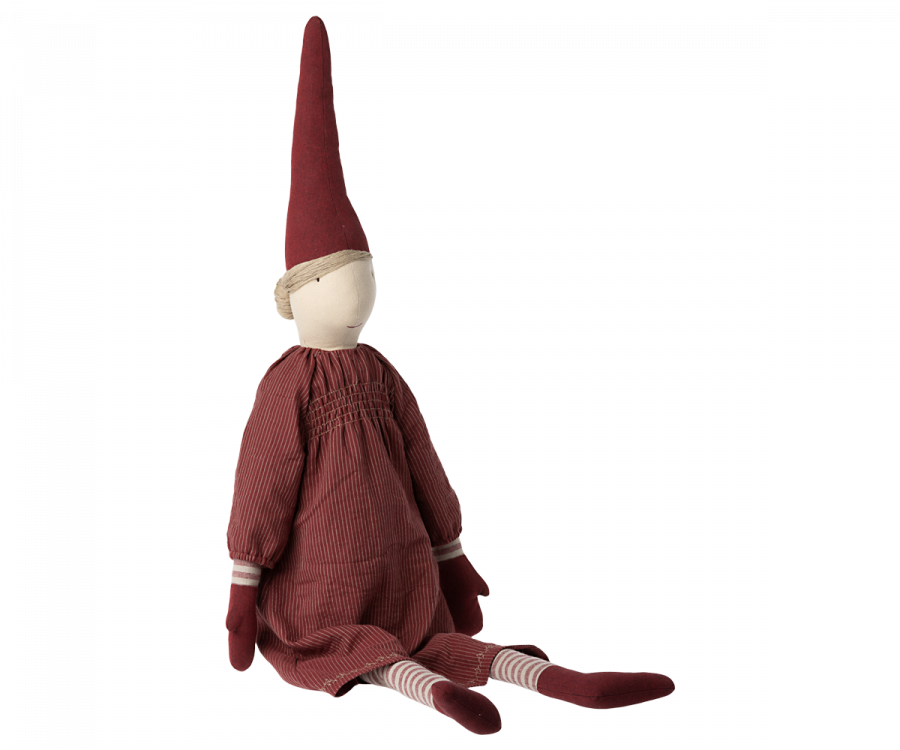 A Maileg Christmas Mega Pixy - (Size 6) with striped legs and arms, wearing a red pointed hat and an exclusive materials red striped dress, sitting against a white background.