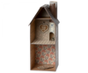 A decorative wooden dollhouse styled as a Maileg Cardboard Two-Story Gingerbread House with detailed interior wallpaper and a welcoming sign that reads "Gingerbread House.