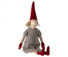A Maileg Christmas Pixy (Size 5) with a long red hat, simple facial features, and a grey dress made from exclusive materials, sitting against a white background.