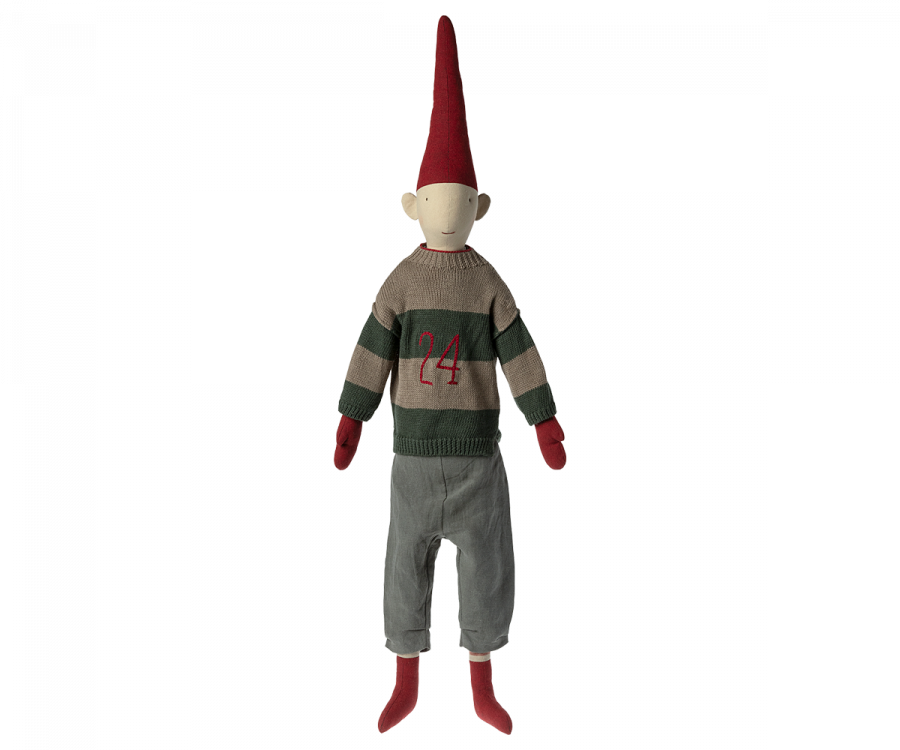 A Maileg Christmas Pixy (Size 6) resembling an elf, featuring a red pointed hat, a striped gray and green sweater with the number 24, exclusive materials for its gray pants, and red shoes, standing against a transparent background.