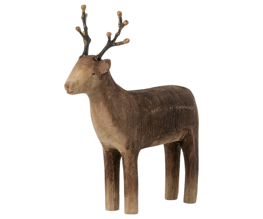 A Maileg wooden reindeer candle holder with detailed carving, featuring textured fur and intricate antlers, against a white background. Sold separately.