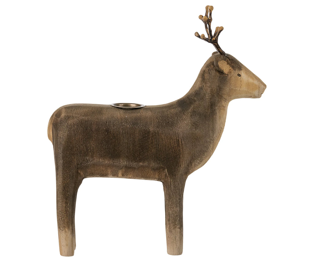 The Maileg Wooden Reindeer Candle Holder with an antique finish, displaying intricate detailing and a small candle cup on its back. Perfect for holiday decor, sold separately.