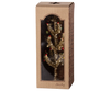 The Maileg Christmas Tree - Gold with Red and Green comes in a brown box with a transparent front, showcasing its small artificial gold design adorned with red and green ornaments. The packaging, ideal for home decoration, features a subtle striped pattern.