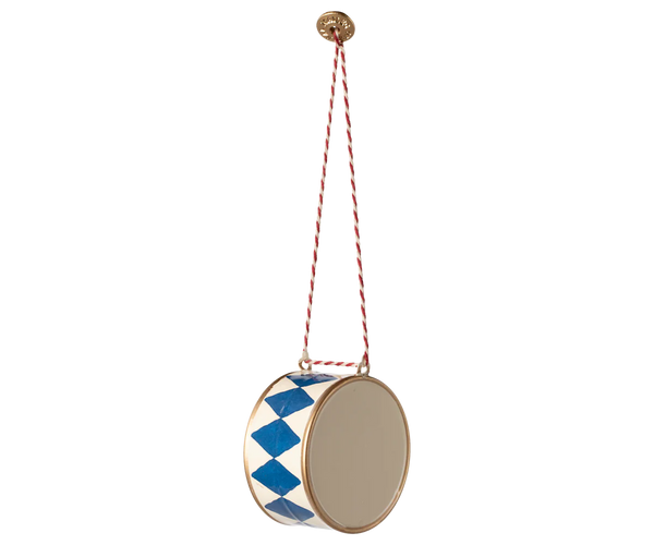 The Maileg Metal Ornament - Large Drum, Dark Blue features hand-painted blue diamond patterns and hangs from a red and white cord—an ideal festive ornament for your Christmas tree.