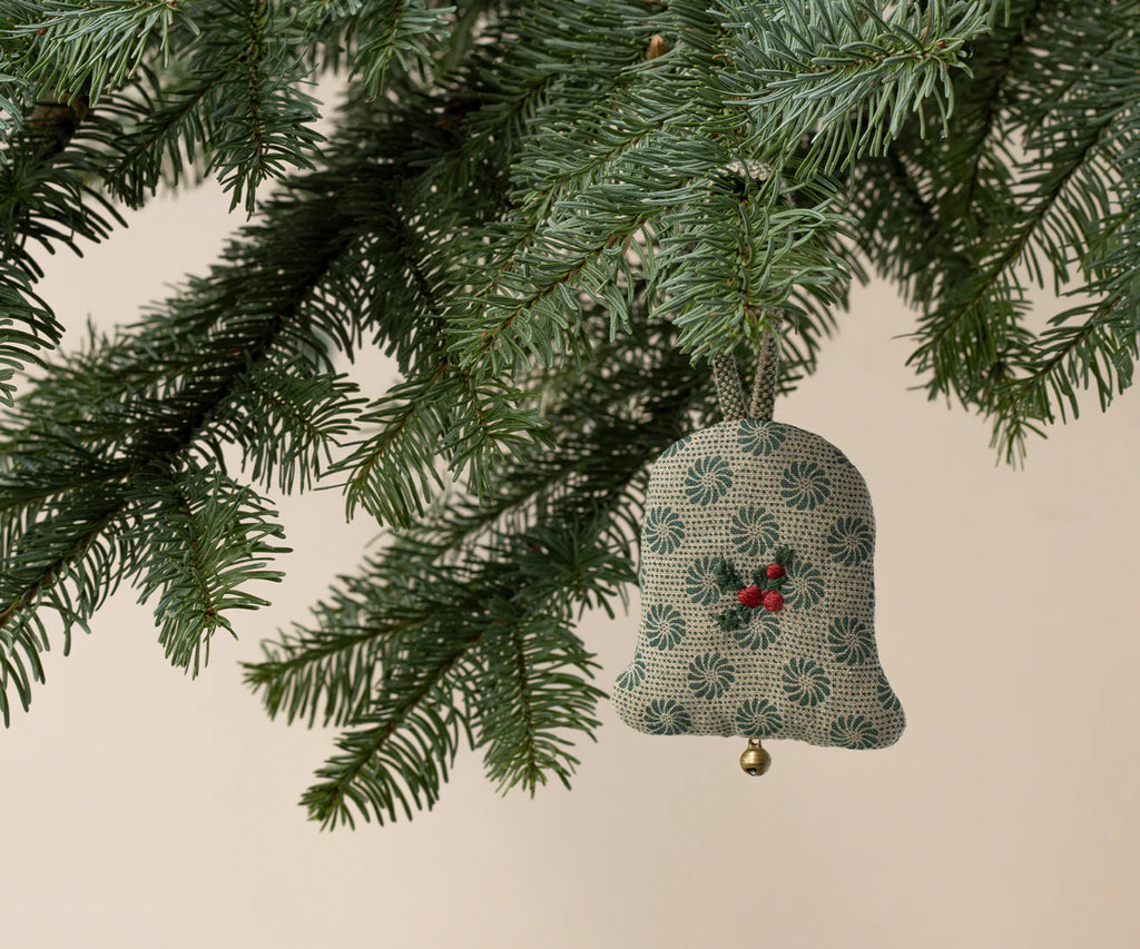 The Maileg Fabric Ornament - Bell, Small features a green and white pattern, red embroidery, and a gold bell—perfect for adding charm to your Christmas tree decorations.