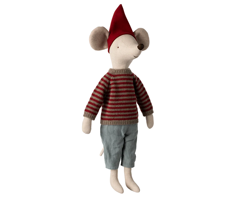 The Maileg Christmas Maxi Mouse is joyfully adorned in a festive Christmas hat, paired with a cozy red and gray striped sweater and light blue pants, standing happily against a simple background.