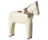 The Maileg Wooden Horse Candle Holder captures a cozy Christmas ambiance as it features a festive garland of metallic tinsel, purple and green baubles, and a small gold bell. This white wooden horse showcases simplistic painted details with subtle star motifs on its side.