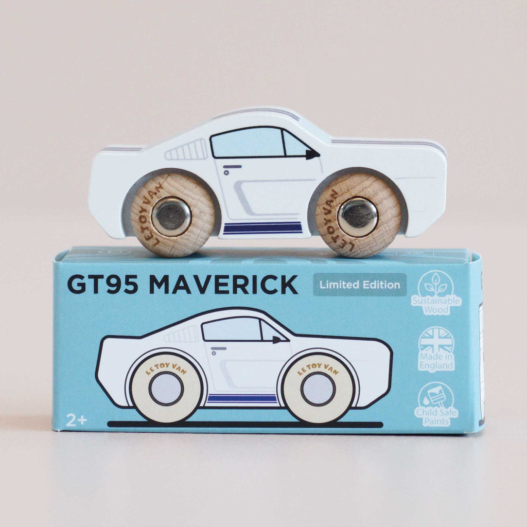 A wooden pony car, the No. 17 GT95 Maverick made in England, sits atop its matching blue box adorned with sustainability and safety icons—a beloved classic reimagined with timeless style and eco-friendly craftsmanship.