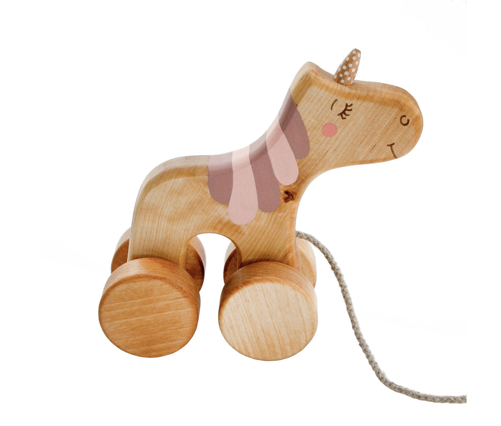 A Handmade Wooden Unicorn Pull Toy with a painted face and cut-out details, featuring soft pink ears and a patterned mane. The unicorn, crafted from sustainably harvested birch wood, is set on four round wooden wheels and has a pull string.