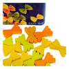 Colorful wooden pieces shaped like farfalle pasta are scattered on a white surface, with an Erzi Farfalle Pasta Pretend Food tin—featuring images of farfalle and "100% Holz"—in the background.