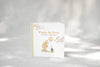 The board book Winnie-the-Pooh: Finding Feelings stands upright on a light surface, featuring Pooh with a balloon talking to Piglet about emotions for toddlers.