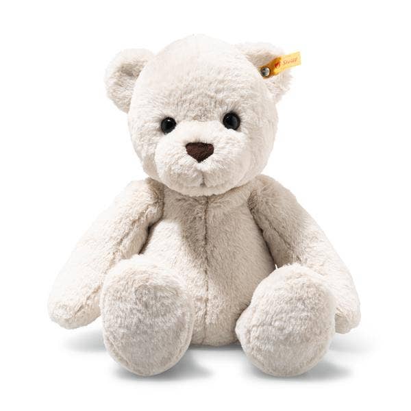 The Steiff Robby Teddy Bear 17" is a soft, light beige plush toy with dark eyes, a brown nose, and a yellow ear tag, sitting upright against a white background—perfect for winter cuddles.